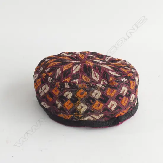 A Turkoman embroidered boy’s cap, typical colours. Dia.160mm.